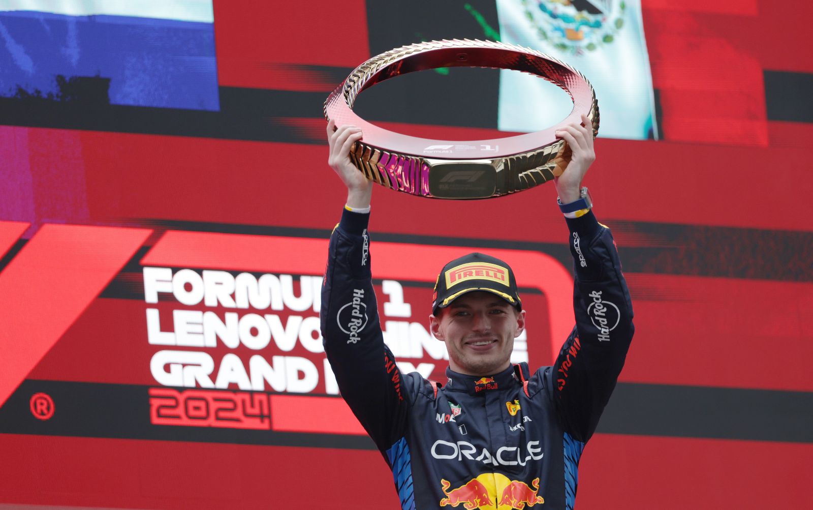 epa11291206 Red Bull Racing driver Max Verstappen of the Netherlands celebrates with his trophy after winning the Formula One Chinese Grand Prix, in Shanghai, China, 21 April 2024. The 2024 Formula 1 Chinese Grand Prix is held at the Shanghai International Circuit racetrack on 21 April after a five-year hiatus.  EPA/ALEX PLAVEVSKI