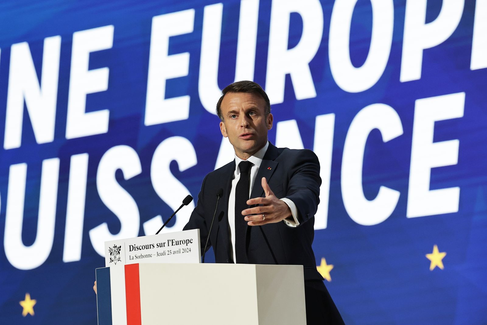 epa11299565 French President Emmanuel Macron delivers a speech on Europe next to a slogan reading 'A powerful Europe' in the amphitheater of the Sorbonne University in Paris, France, 25 April 2024. Macron is to speak about the future of the European Union nearly seven years after his previous speech and ahead of the European elections on 09 June.  EPA/CHRISTOPHE PETIT TESSON / POOL