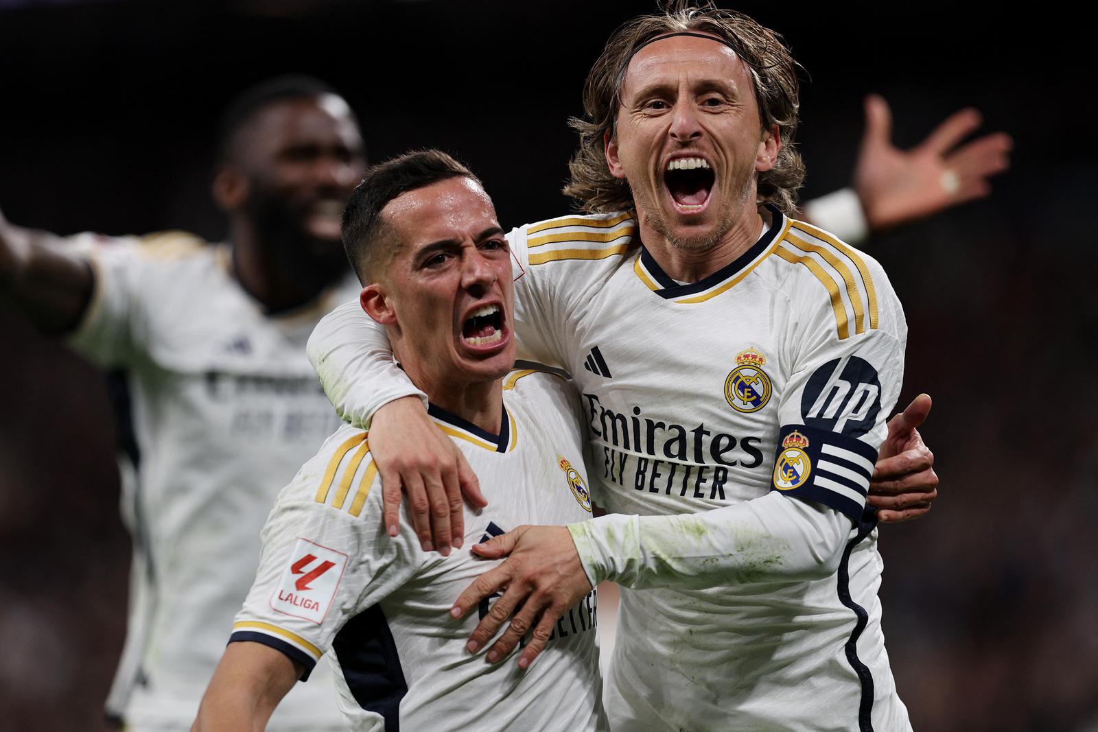 Soccer Football - LaLiga - Real Madrid v Sevilla - Santiago Bernabeu, Madrid, Spain - February 25, 2024  Real Madrid's Luka Modric celebrates scoring their first goal with Lucas Vazquez REUTERS/Violeta Santos Moura Photo: VIOLETA SANTOS MOURA/REUTERS