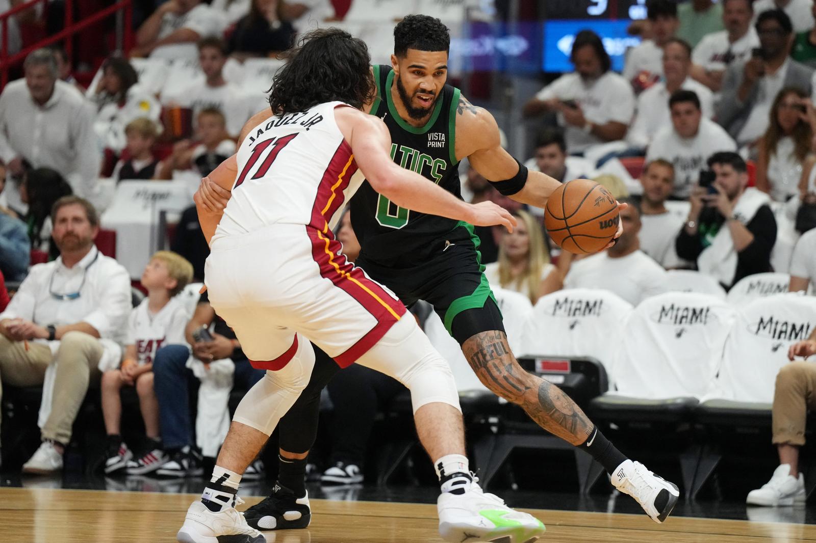 Apr 27, 2024; Miami, Florida, USA; Boston Celtics forward Jayson Tatum (0) drives to the baseline as Miami Heat guard Jaime Jaquez Jr. (11) defends in the first half during game three of the first round for the 2024 NBA playoffs at Kaseya Center. Mandatory Credit: Jim Rassol-USA TODAY Sports Photo: Jim Rassol/REUTERS
