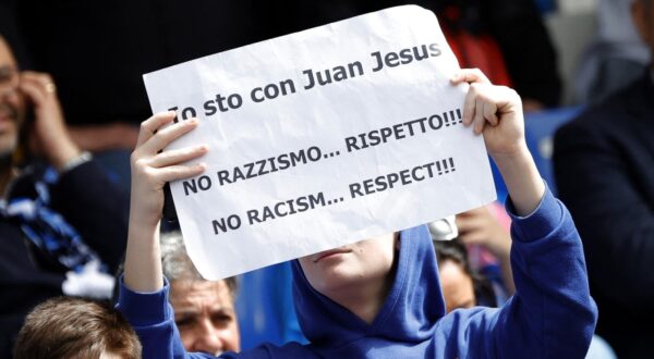 Soccer Football - Serie A - Napoli v Atalanta - Stadio Diego Armando Maradona, Naples, Italy - March 30, 2024 Napoli fan with a sign in protest after Inter Milan's Francesco Acerbi was cleared of a charge of racially insulting Napoli's Juan Jesus in a Serie A game REUTERS/Ciro De Luca Photo: CIRO DE LUCA/REUTERS