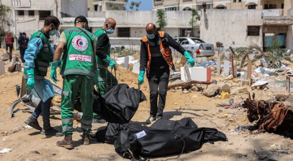 Palestinian paramedics carry away bodies of dead people uncovered in the vicinity of Al-Shifa Hospital in Gaza City on April 17, 2024 after the recent Israeli military operation there amid the ongoing fighting in the Palestinian territory between Israel and the militant group Hamas.,Image: 865665312, License: Rights-managed, Restrictions: Graphic Content, Model Release: no, Credit line: AFP / AFP / Profimedia