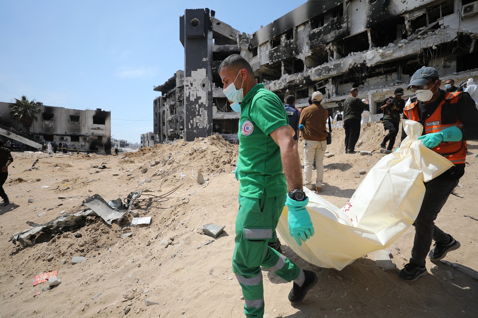 GAZA CITY, GAZA - APRIL 08: Gazan teams from health department, civil defense, crime scene investigation, and forensics carry out investigation at the scene after Israeli siege and attacks that completely destroyed Gaza's Al-Shifa Hospital, leaving hundreds killed including displaced families, patients and doctors in Gaza City, Gaza on April 08, 2024. The teams commenced efforts to recover the bodies and identify the Palestinians who lost their lives during the assault on the Al-Shifa Medical Complex. The facility was rendered completely unusable during the 14-day attack launched by Israeli forces, starting on March 18. Dawoud Abo Alkas / Anadolu,Image: 863340868, License: Rights-managed, Restrictions: , Model Release: no, Credit line: Dawoud Abo Alkas / AFP / Profimedia