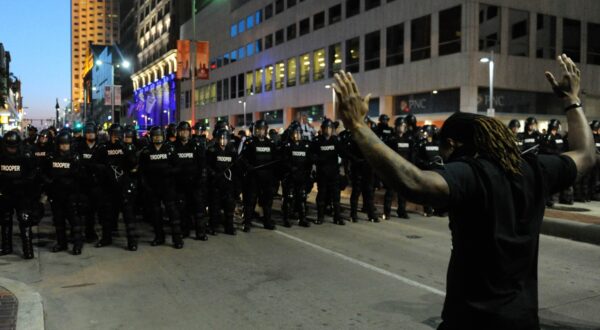 (150524) -- CLEVELAND, May 24, 2015 () -- A protester holds up his hands before police in Cleveland, Ohio, the United States, May 23, 2015. Shortly after a white police officer in the U.S. state of Ohio was found not guilty in the killing of an unarmed black man and woman after a 22-mile car chase in November 2012, U.S. Justice Department announced that it would review the case.,Image: 246289634, License: Rights-managed, Restrictions: , Model Release: no, Credit line: Bao Dandan / Avalon / Profimedia