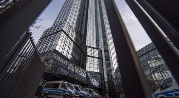 Police vehicles are parked at Deutsche Bank's headquarters in Frankfurt on November 29, 2018.  German prosecutors raided several Deutsche Bank offices in the Frankfurt area on November 29, 2018 over suspicions of money laundering based on revelations from the 2016 "Panama Papers" data leak.,Image: 399034769, License: Rights-managed, Restrictions: Germany OUT, Model Release: no, Credit line: Boris Roessler / AFP / Profimedia