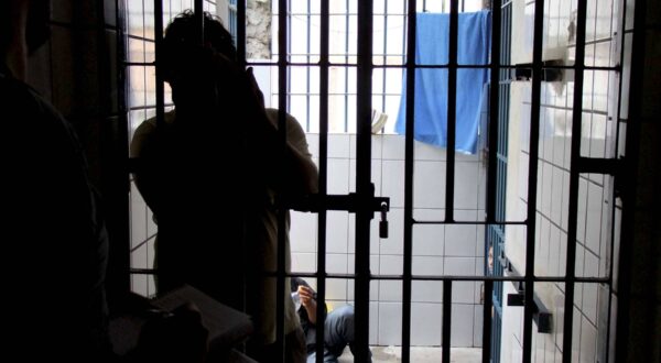 prisoner in police station eunapolis, bahia / brazil - december 4, 2009: Convict is seen next to cell bars of Eunapolis City Police Station. *** Local Caption *** . EUNAPOLIS BAHIA BRASIL Copyright: xJoaxSouzax 041209JOA01F,Image: 803148862, License: Rights-managed, Restrictions: imago is entitled to issue a simple usage license at the time of provision. Personality and trademark rights as well as copyright laws regarding art-works shown must be observed. Commercial use at your own risk., Credit images as "Profimedia/ IMAGO", Model Release: no, Credit line: Joa Souza / imago stock&people / Profimedia