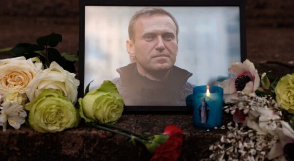 A portrait of Alexei Navalny, candles and flowers are left at a memorial in Paris on February 16, 2024, after the announcement that the Kremlin's most prominent critic had died in an Arctic prison. Russia's top opposition politician Alexei Navalny died on February 16, 2024 at the Arctic prison colony where he was serving a 19-year-term. His death after three years in detention and a poisoning which he blamed on the Kremlin deprives Russia's opposition of its figurehead at time of intense repression and Moscow's campaign in Ukraine.,Image: 847265383, License: Rights-managed, Restrictions: , Model Release: no, Credit line: Ian LANGSDON / AFP / Profimedia