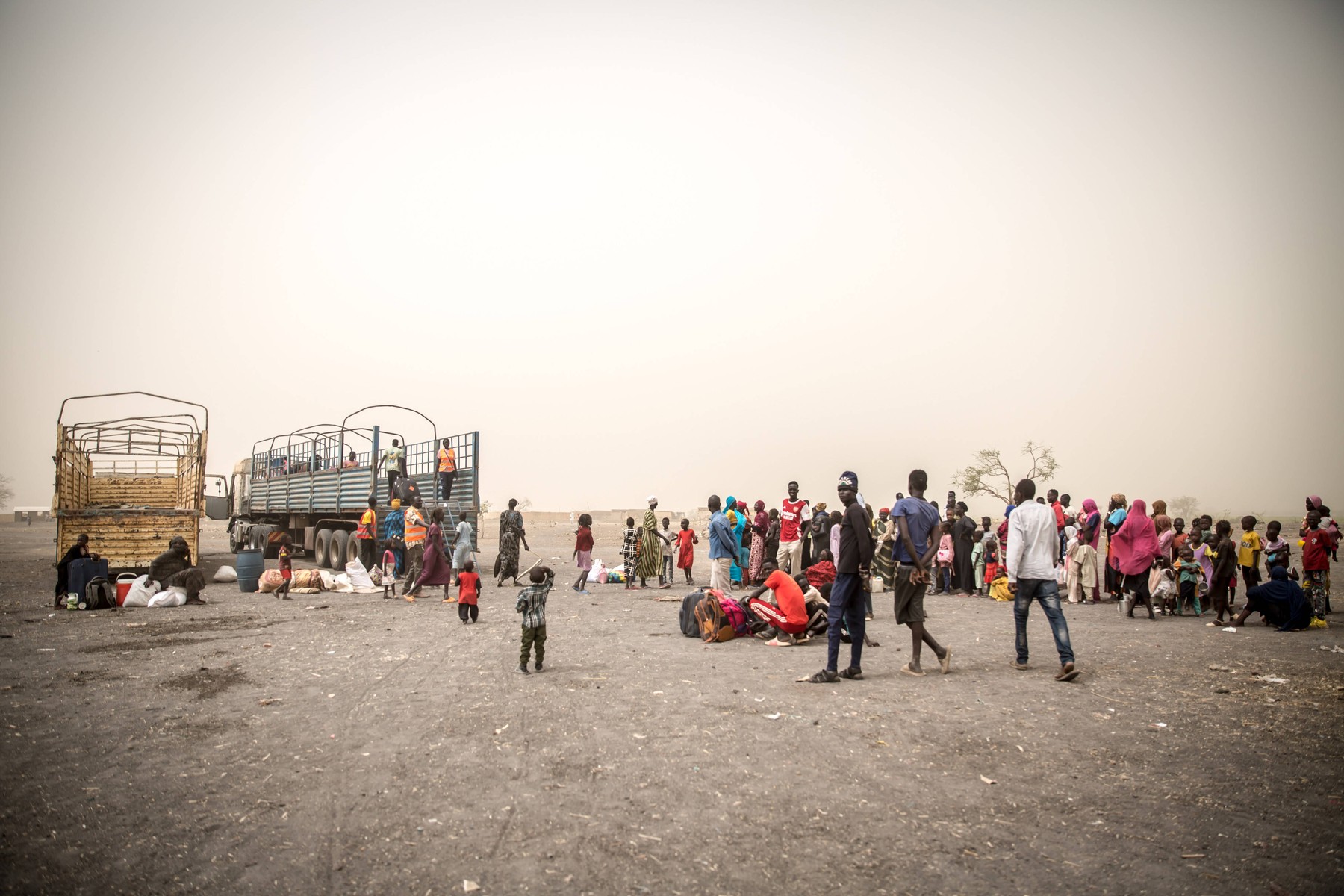 People wait to be loaded into trucks to take them from Joda, on the Sudanese border, to Renk in South Sudan, where they will stay in a transit camp before they are transported further into the country. Around 1,000 South Sudanese returnees and Sudanese refugees are crossing the border from Sudan to South Sudan every day. Sudan's war, which began in April 2023, has resulted in the world's largest displacement crisis. - Sally Hayden / SOPA Images//SOPAIMAGES_SHayden_200324_BK9B1701/Credit:SOPA Images/SIPA/2403251602,Image: 859467720, License: Rights-managed, Restrictions: , Model Release: no, Credit line: SOPA Images / Sipa Press / Profimedia