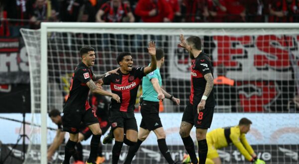 Bayer Leverkusen's French forward #21 Amine Adli (C) celebrates scoring the 1-2 goal with his team-mates during the German first division Bundesliga football match Bayer 04 Leverkusen v VfL Stuttgart in Leverkusen, western Germany, on April 27, 2024.,Image: 868427066, License: Rights-managed, Restrictions: DFL REGULATIONS PROHIBIT ANY USE OF PHOTOGRAPHS AS IMAGE SEQUENCES AND/OR QUASI-VIDEO, Model Release: no, Credit line: INA FASSBENDER / AFP / Profimedia