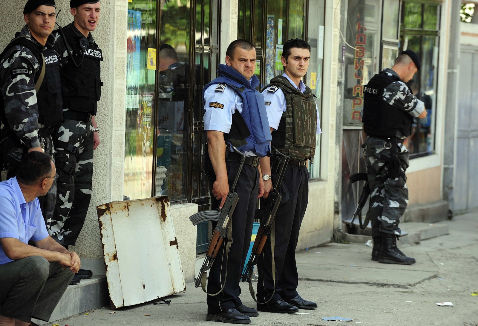 Police officers secure the site of a shooting at a polling station in a primary school in Skopje on June 1, 2008, as the country holds early elections where two separate shootings left one person dead and three wounded. The State Election Commission said voting had been suspended in eight polling stations in Aracinovo. Shootings that led to one death and several injuries, and reports of stolen ballot boxes and ballot stuffing have forced elections officials to suspend voting in at least 17 polling stations, marring the start of Macedonia's early parliamentary election.,Image: 25644987, License: Rights-managed, Restrictions: , Model Release: no, Credit line: ROBERT ATANASOVSKI / AFP / Profimedia
