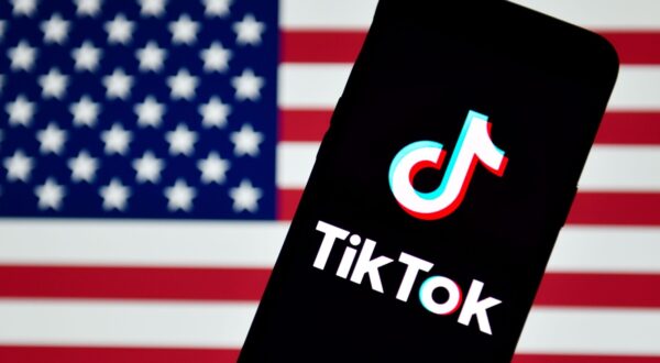In this photo illustration a TikTok logo is seen displayed on a smartphone with the chinese flag in the background. - Sheldon Cooper / SOPA Images//SOPAIMAGES_TikTok(2)/2009141023/Credit:SOPA Images / SIPA/SIPA/2009141024,Image: 557871230, License: Rights-managed, Restrictions: , Model Release: no, Credit line: SOPA Images / Sipa Press / Profimedia