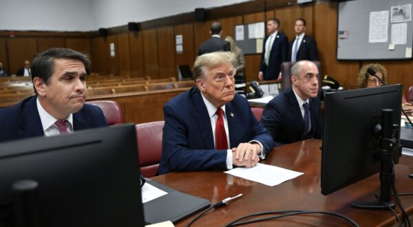 epa11280080 Former US President Donald Trump (C) attends the first day of his trial for allegedly covering up hush money payments linked to extramarital affairs, at Manhattan Criminal Court in New York City, New York, USA, 15 April 2024. Trump is charged with 34 felony counts of falsifying business records related to payments made to adult film actress Stormy Daniels during his 2016 presidential campaign.  EPA/ANGELA WEISS / POOL