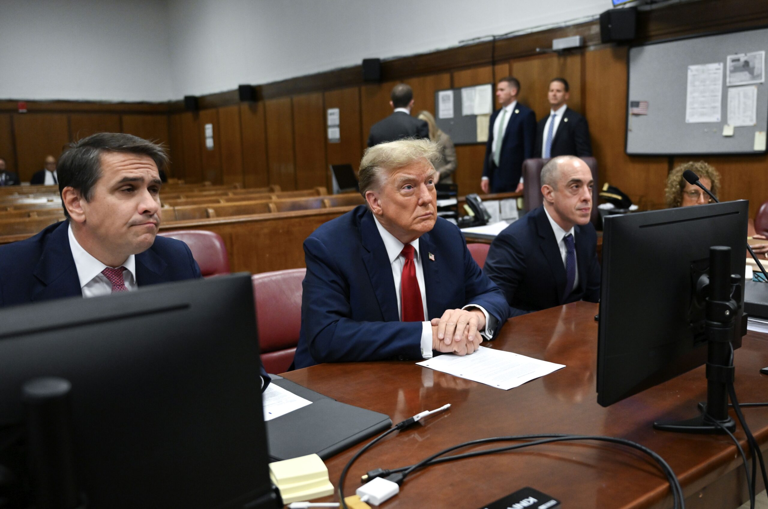 epa11280080 Former US President Donald Trump (C) attends the first day of his trial for allegedly covering up hush money payments linked to extramarital affairs, at Manhattan Criminal Court in New York City, New York, USA, 15 April 2024. Trump is charged with 34 felony counts of falsifying business records related to payments made to adult film actress Stormy Daniels during his 2016 presidential campaign.  EPA/ANGELA WEISS / POOL