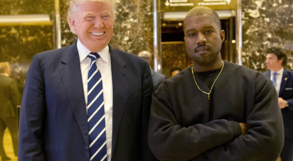 FILE - In this Dec. 13, 2016, file photo, President-elect Donald Trump and Kanye West pose for a picture in the lobby of Trump Tower in New York. West has deleted tweets posted on Dec. 13, 2016, explaining the meeting. (AP Photo/Seth Wenig, File)