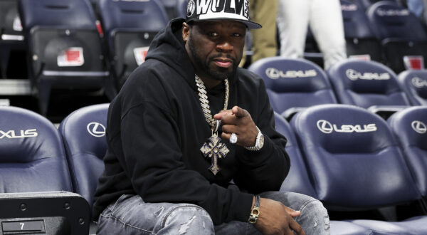 50 Cent poses for a photo prior to an NBA basketball game between the Washington Wizards and the Minnesota Timberwolves, Tuesday, April 9, 2024, in Minneapolis. (AP Photo/Matt Krohn)