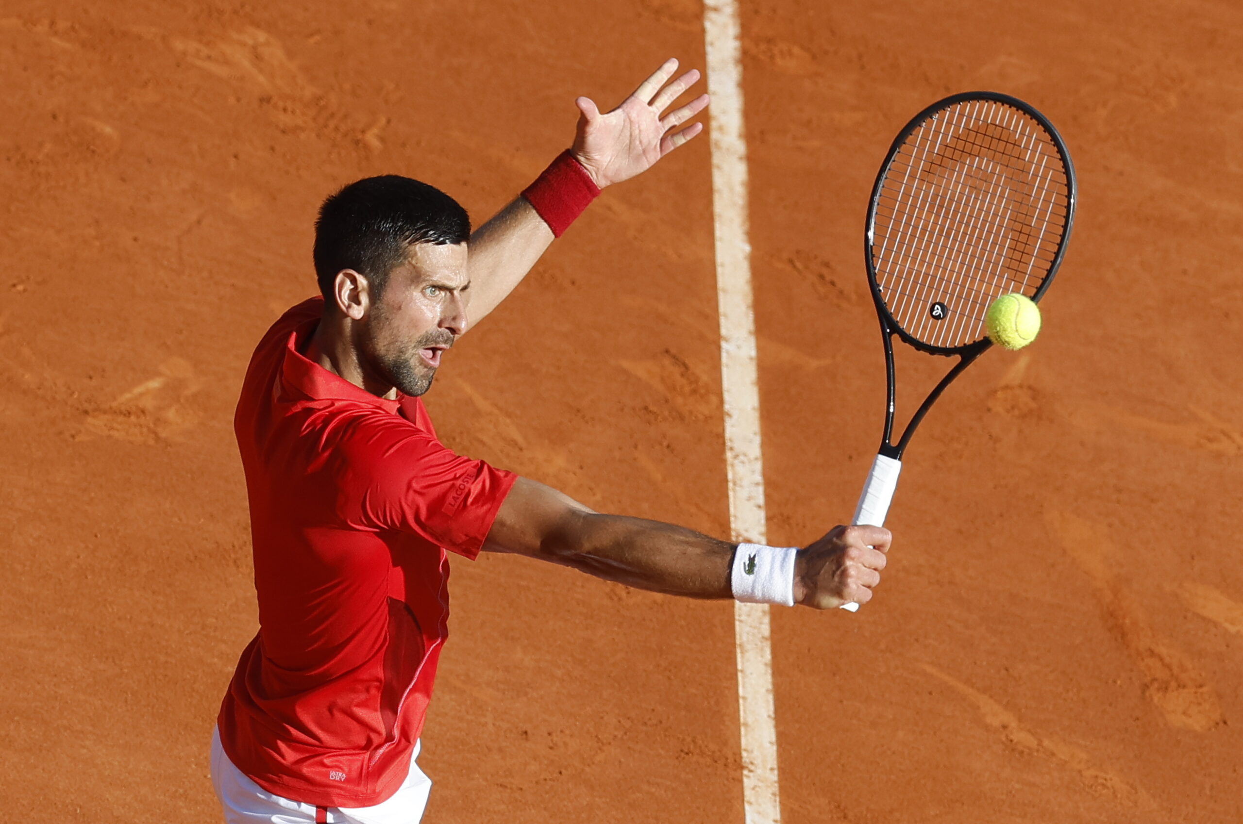 epa11276656 Novak Djokovic of Serbia in action during his semi final match against Casper Ruud of Norway at the ATP Monte Carlo Masters tennis tournament in Roquebrune Cap Martin, France, 13 April 2024.  EPA/SEBASTIEN NOGIER