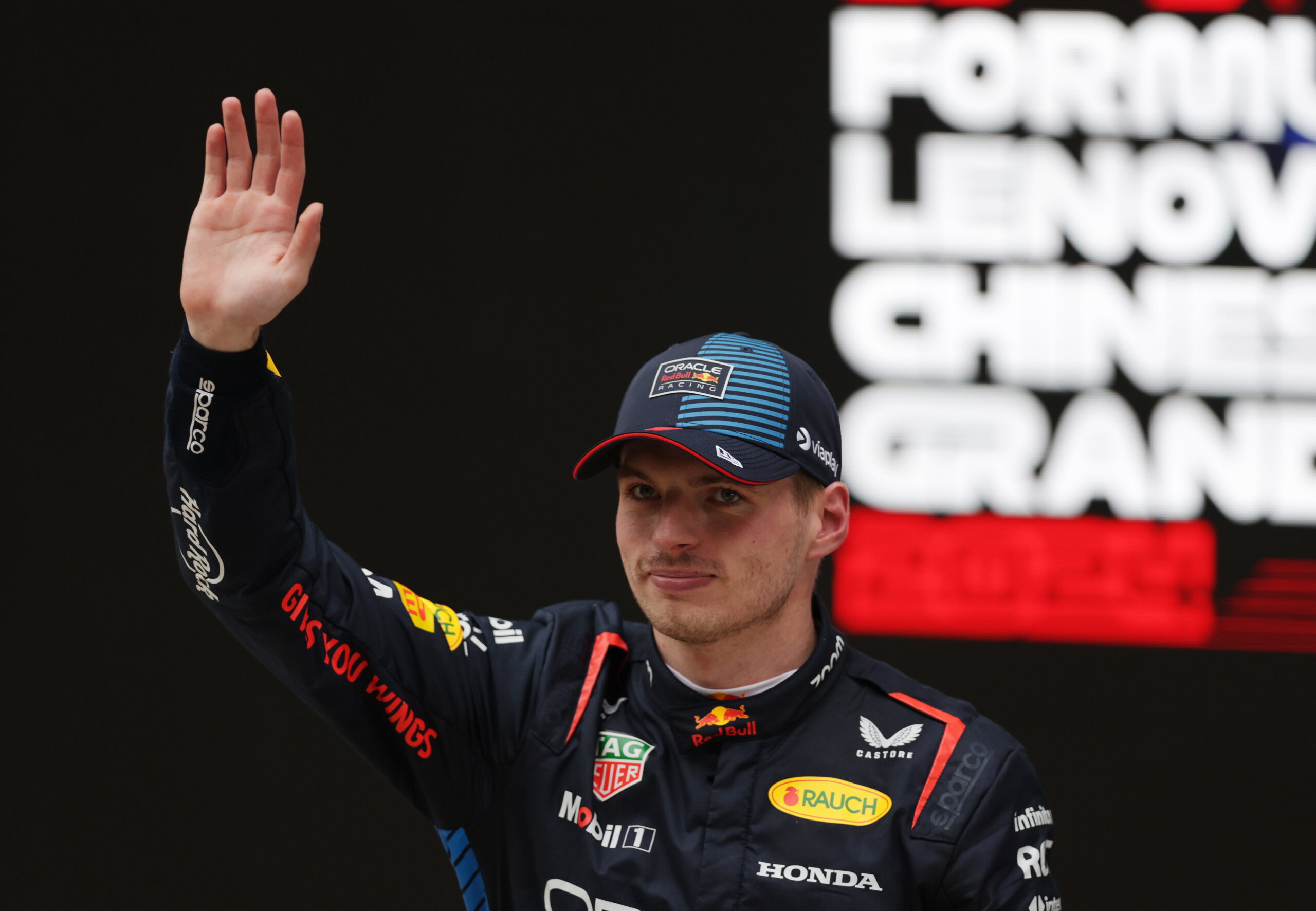 epa11291202 Red Bull Racing driver Max Verstappen of the Netherlands waves after winning the Formula One Chinese Grand Prix, in Shanghai, China, 21 April 2024. The 2024 Formula 1 Chinese Grand Prix is held at the Shanghai International Circuit racetrack on 21 April after a five-year hiatus.  EPA/ALEX PLAVEVSKI