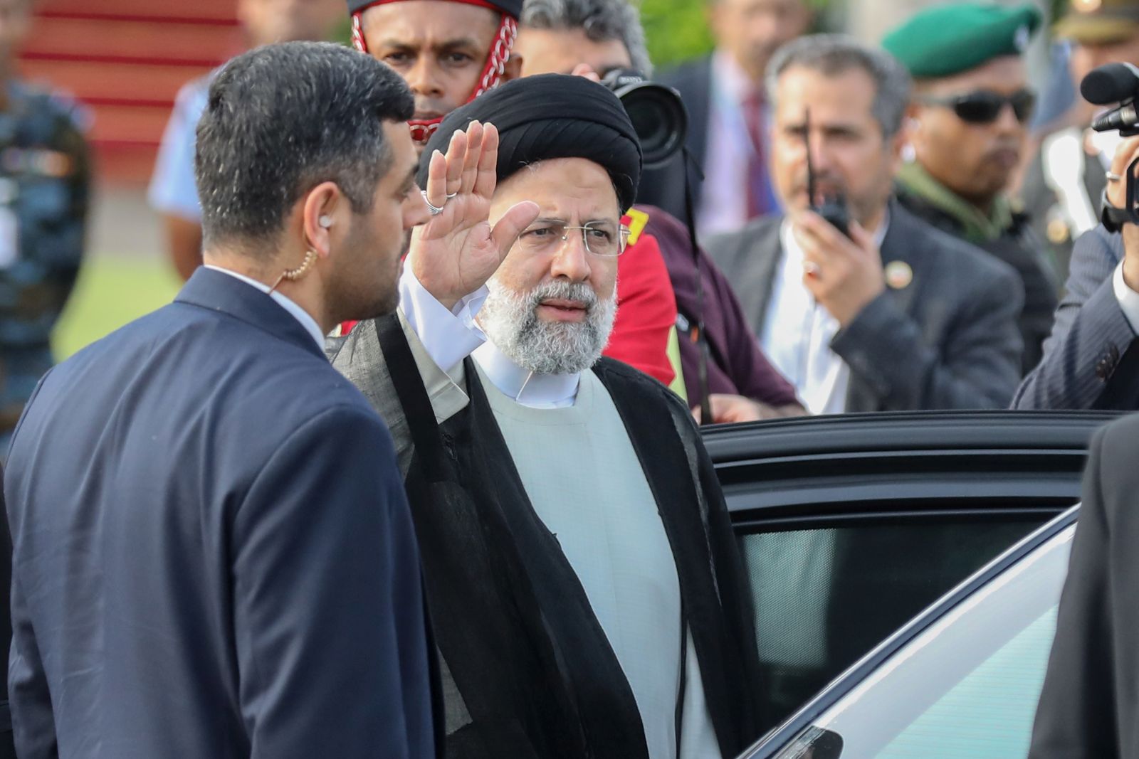 epa11297506 Iranian President Ebrahim Raisi waves upon his arrival at Bandaranaike International Airport in Colombo, Sri Lanka, 24 April 2024. The Iranian president is on a one-day official visit to Sri Lanka.  EPA/CHAMILA KARUNARATHNE