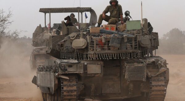 epa11300497 An Israeli tank at a gathering location on the southern Israeli border with the Gaza Strip near Rafah, 25 April 2024. More than 34,000 Palestinians and over 1,450 Israelis have been killed, according to the Palestinian Health Ministry and the Israel Defense Forces (IDF), since Hamas militants launched an attack against Israel from the Gaza Strip on 07 October 2023, and the Israeli operations in Gaza and the West Bank which followed it.  EPA/ATEF SAFADI