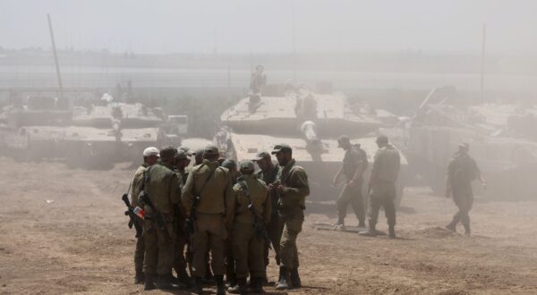 epa11328513 Israeli soldiers with military vehicles gather at an undisclosed position near the border fence with the Gaza Strip, in southern Israel, 09 May 2024. US Defense Secretary Austin at a Senate Appropriations Committee meeting on 08 May confirmed the Biden administration's decision to pause a shipment of 'high payload munitions' to Israel amid concerns over an Israeli major offensive in the southern Gaza city of Rafah. The Israeli military on 06 May called on residents of eastern Rafah to 'temporarily' evacuate to an expanded humanitarian area. On 07 May, Israel said that its troops began an operation targeting Hamas militants and infrastructure within specific areas of eastern Rafah, taking operational control of the Gazan side of the Rafah crossing. More than 34,800 Palestinians and over 1,455 Israelis have been killed, according to the Palestinian Health Ministry and the Israel Defense Forces (IDF), since Hamas militants launched an attack against Israel from the Gaza Strip on 07 October 2023, and the Israeli operations in Gaza and the West Bank which followed it.  EPA/ABIR SULTAN