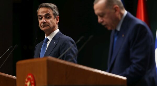 epa11337396 Greek Prime Minister Kyriakos Mitsotakis (L) looks on during a press conference withTurkish President Recep Tayyip Erdogan (R) after their meeting at the Presidential Palace in Ankara, Turkey, 13 May 2024.  EPA/NECATI SAVAS