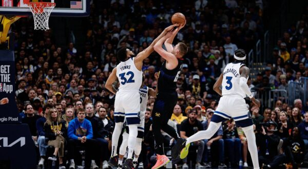 May 6, 2024; Denver, Colorado, USA; Denver Nuggets center Nikola Jokic (15) attempts a shot as Minnesota Timberwolves center Karl-Anthony Towns (32) defends in the first quarter during game two of the second round for the 2024 NBA playoffs at Ball Arena. Mandatory Credit: Isaiah J. Downing-USA TODAY Sports Photo: Isaiah J. Downing/REUTERS
