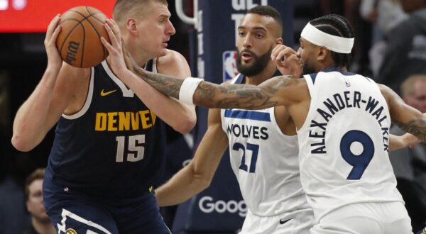 May 12, 2024; Minneapolis, Minnesota, USA; Denver Nuggets center Nikola Jokic (15) works around Minnesota Timberwolves center Rudy Gobert (27) and guard Nickeil Alexander-Walker (9) in the third quarter of game four of the second round for the 2024 NBA playoffs at Target Center. Mandatory Credit: Bruce Kluckhohn-USA TODAY Sports Photo: Bruce Kluckhohn/REUTERS