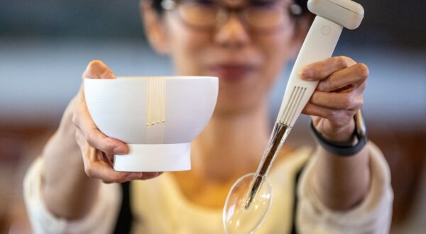 This picture taken on November 20, 2023 shows Ai Sato, from the health science business division of Kirin Holdings, displaying a spoon and bowl that enhance the salty taste of low-sodium food, at the city hall in Odawara, Kanagawa prefecture, south of Tokyo. The spoons and bowls were developed to help people who are trying to reduce salt intake, yet still enjoy traditionally salty dishes like ramen noodles and Japanese miso soup.,Image: 848971278, License: Rights-managed, Restrictions: , Model Release: no, Credit line: Philip FONG / AFP / Profimedia
