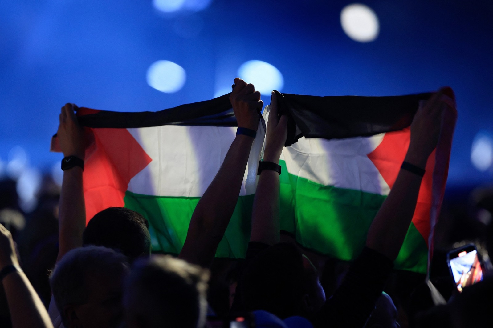Members of the audience hold up Palestinian flags during the final dress-rehearsal of the 68th edition of the Eurovision Song Contest (ESC) at the Malmo Arena, in Malmo, Sweden, on May 11, 2024. Dutch contestant Joost Klein was dropped from the Eurovision final just hours before the event following an incident unlinked to the controversy over Israel's participation amid the Gaza war.,Image: 871994950, License: Rights-managed, Restrictions: Sweden OUT, Model Release: no, Credit line: Andreas HILLERGREN / AFP / Profimedia
