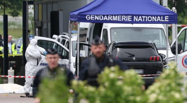 A forensic is at work as police officers patrol at the site of a ramming attack which took place late morning at a road toll in Incarville in the Eure region of northern France, on May 14, 2024. Two French prison officers were killed and two others wounded on May 14 in an attack on a prison van transporting an inmate who escaped, a police source told AFP.,Image: 872872981, License: Rights-managed, Restrictions: , Model Release: no, Credit line: ALAIN JOCARD / AFP / Profimedia