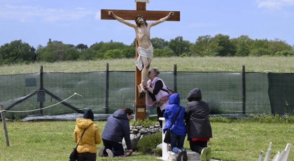 Italy, Trevignano - May 3, 2023.Crucifix next to the he statue of the Madonna of Trevignano. For almost five years, the Madonna of Trevignano on Lake Bracciano has been crying tears of blood, on the 3rd of each month.La Madonna di Trevignano al Campo delle Rose.,Image: 773761295, License: Rights-managed, Restrictions: * France, Germany and Italy Rights Out *, Model Release: no, Credit line: Mistrulli/Fotogramma / Zuma Press / Profimedia