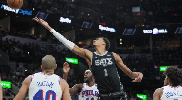 Apr 7, 2024; San Antonio, Texas, USA;  San Antonio Spurs center Victor Wembanyama (1) shoots in between Philadelphia 76ers forwards Nicolas Batum (40) and Paul Reed (44) in the first half at Frost Bank Center.,Image: 863205728, License: Rights-managed, Restrictions: , Model Release: no, Credit line: USA TODAY Sports / ddp USA / Profimedia