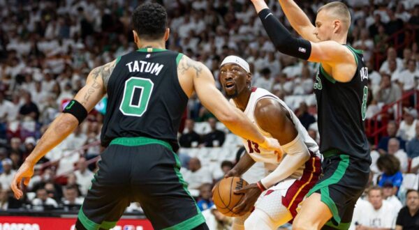April 29, 2024: Miami Heat center Bam Adebayo (13) tries to score as Boston Celtics center Kristaps Porzingis (8) and forward Jayson Tatum (0) defend in the first half of Game 4 of an NBA basketball first-round playoff series at the Kaseya Center on Monday, April 29, 2024, in Miami.,Image: 869030540, License: Rights-managed, Restrictions: , Model Release: no, Credit line: Matias J. Ocner / Zuma Press / Profimedia