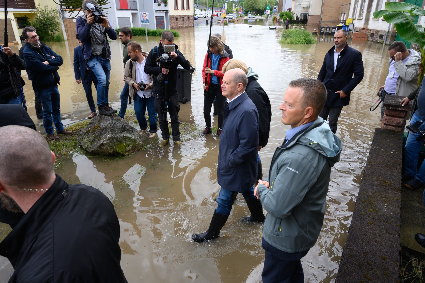 German Chancellor Olaf Scholz wades through water as they visit flood stricken town of Kleinblittersdorf on May 18, 2024, after heavy rains caused flooding, swamping streets and buildings and sparking evacuations in south west Germany. In the southwestern German state of Saarland, streets were deep underwater and images on social media showed emergency workers carrying local residents to safety in boats. State capital Saarbruecken was hard hit while German daily Bild reported that a breach in a dyke in the town of Quierschied led to a power station in the area being shut down.,Image: 874117690, License: Rights-managed, Restrictions: , Model Release: no, Credit line: Iris Maria Maurer / AFP / Profimedia