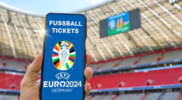 20 May 2024: Hand holding smartphone in soccer stadium with the UEFA EURO, EM, Europameisterschaft,Fussball 2024 logo and the lettering: Football Tickets. Symbolic image of tickets for the European Championship, EM, Europameisterschaft 2024. PHOTOMONTAGE *** Hand hält Smartphone in Fußball Stadion mit dem UEFA EURO 2024 Logo und dem Schriftzug: Fussball Tickets. Symbolbild Eintrittskarten für die Europameisterschaft 2024. FOTOMONTAGE,Image: 874919133, License: Rights-managed, Restrictions: Credit images as "Profimedia/ IMAGO", Model Release: no, Credit line: IMAGO / imago sportfotodienst / Profimedia