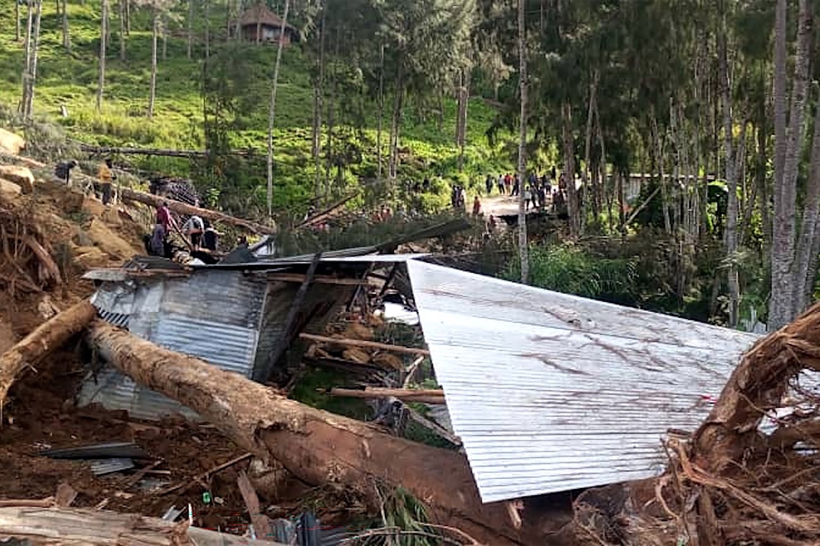 This picture shows a demolished house at the site of a landslide at Yambali Village in the region of Maip Mulitaka, in Papua New Guinea's Enga Province on May 25, 2024. Rescue teams began arriving at the site of a massive landslide in Papua New Guinea's remote highlands on May 25, helping villagers search for the scores of people feared dead under the towering mounds of rubble and mud.,Image: 876245226, License: Rights-managed, Restrictions: , Model Release: no, Credit line: STR / AFP / Profimedia