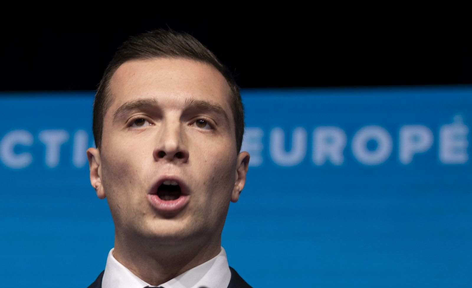 epa11400652 National Rally leader Jordan Bardella delivers a speech at the electoral party of the French right-wing party National Rally (Rassemblement National or RN) in Paris, France, 09 June 2024, after the first results of the European elections. The list of the Rassemblement National, led by party chief Jordan Bardella, is given winner in France according to first estimations after polls.  EPA/ANDRE PAIN