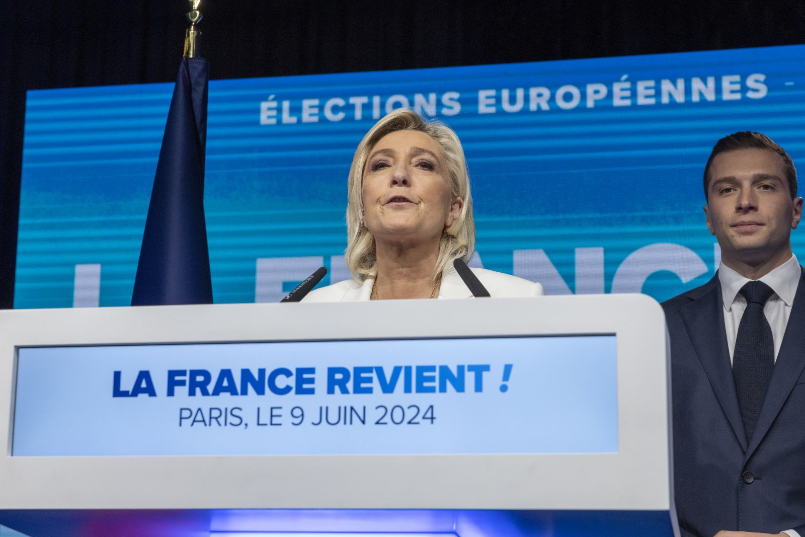 epa11401161 National Rally parliamentary party leader Marine Le Pen delivers a speech standing next to RN president Jordan Bardella (R) at the electoral party of the French right-wing party National Rally (Rassemblement National or RN) in Paris, France, 09 June 2024, after the first results of the European Elections. The list of the Rassemblement National, led by party chief Jordan Bardella, is given winner in France according to first estimations after polls.  EPA/ANDRE PAIN