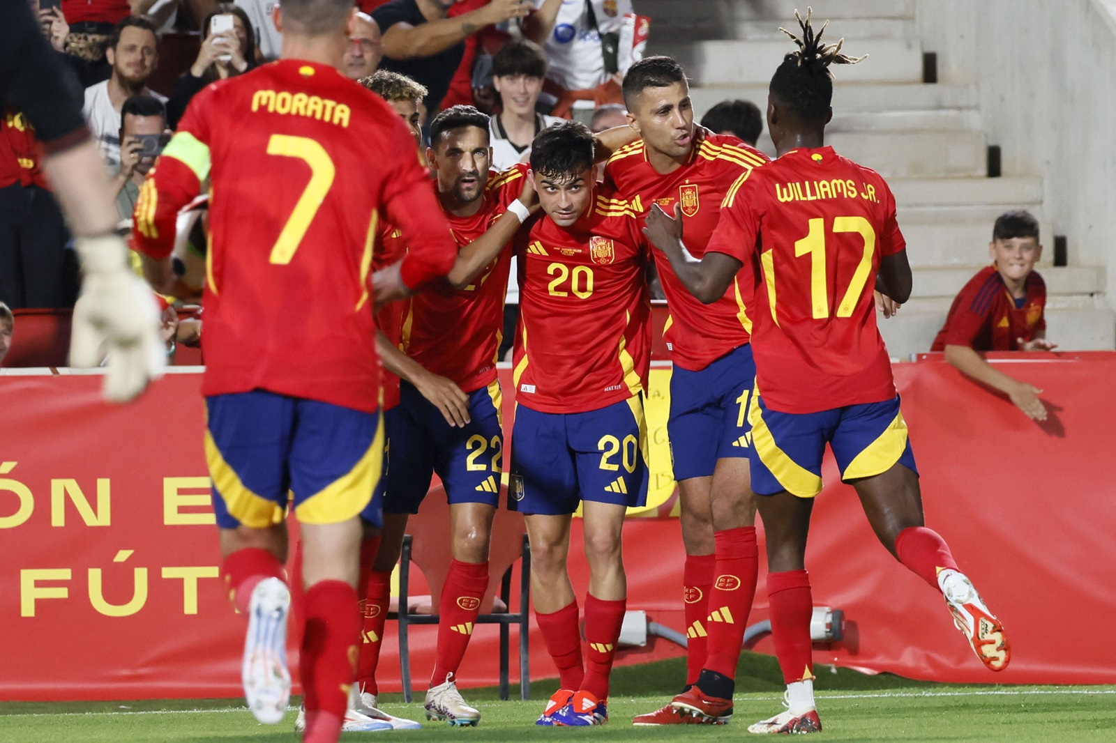epa11398530 Spain's Pedri (C) celebrates with his teammates after scoring the 1-1 tier during the friendly international soccer match between Spain and Northern Ireland, in Palma de Mallorca, Balearic Islands, Spain, 08 June 2024.  EPA/Cati Cladera