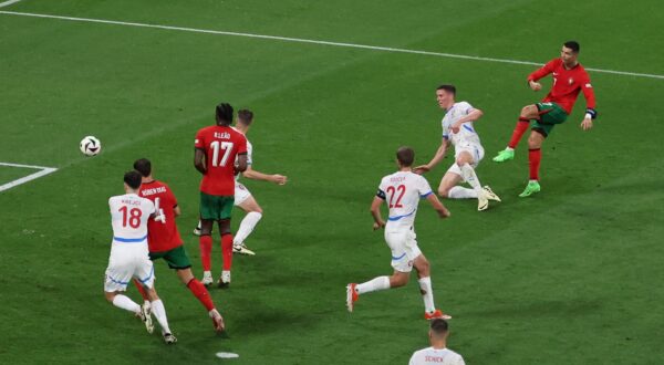 epa11420988 Cristiano Ronaldo of Portugal (R) attempts a shot on goal during the UEFA EURO 2024 group F match between Portugal and Czech Republic, in Leipzig, Germany, 18 June 2024.  EPA/ABEDIN TAHERKENAREH
