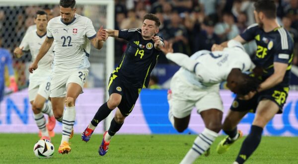 epa11424098 Fabian Schaer (L) of Switzerland in action against Billy Gilmour of Scotland during the UEFA EURO 2024 group A soccer match between Scotland and Switzerland, in Cologne, Germany, 19 June 2024.  EPA/GEORGI LICOVSKI