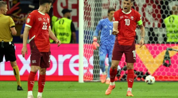 epa11433117 Granit Xhaka of Switzerland (R) reacts to Fabian Rieder of Switzerland during the UEFA EURO 2024 group A soccer match between Switzerland and Germany, in Frankfurt am Main, Germany, 23 June 2024.  EPA/FRIEDEMANN VOGEL