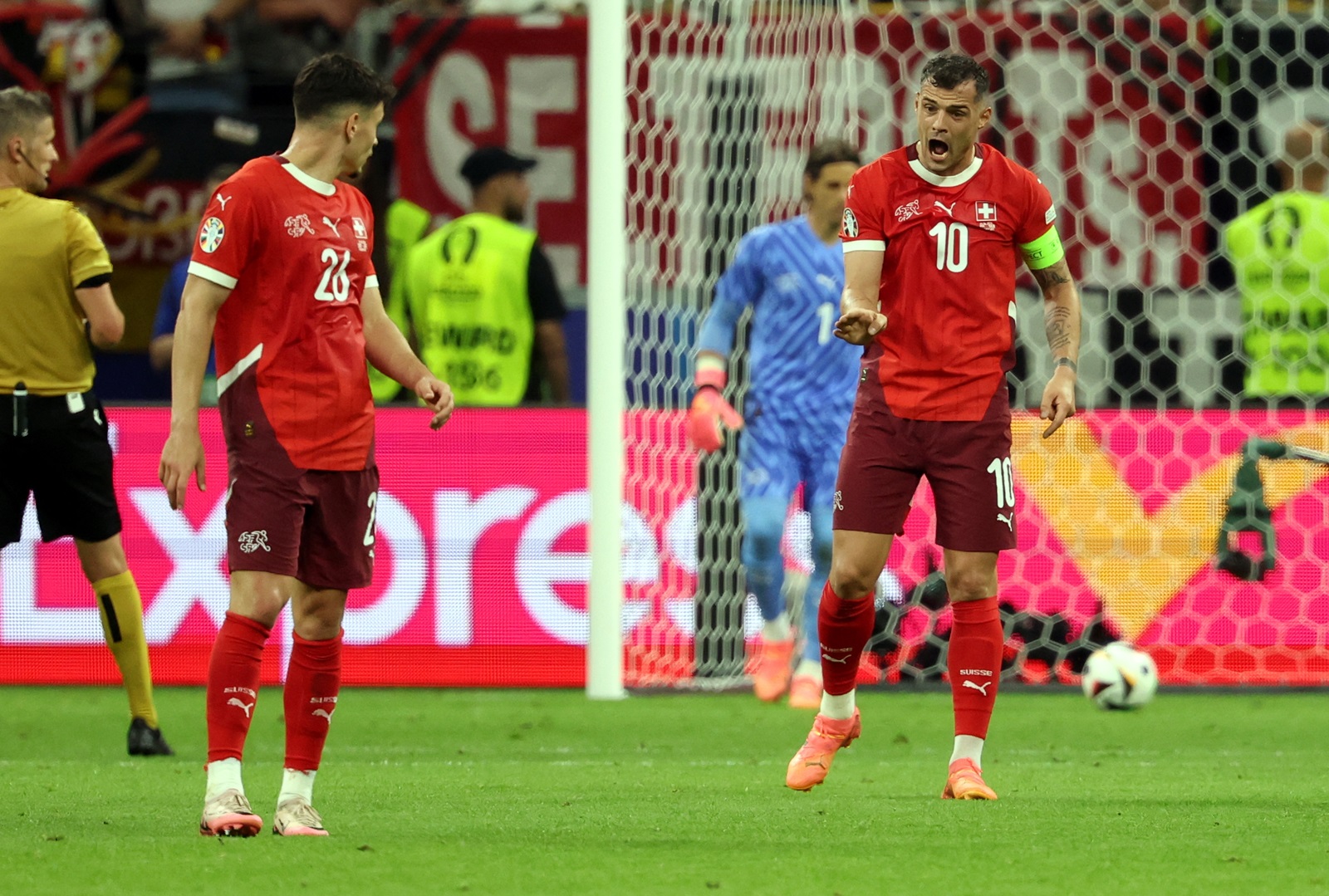 epa11433117 Granit Xhaka of Switzerland (R) reacts to Fabian Rieder of Switzerland during the UEFA EURO 2024 group A soccer match between Switzerland and Germany, in Frankfurt am Main, Germany, 23 June 2024.  EPA/FRIEDEMANN VOGEL