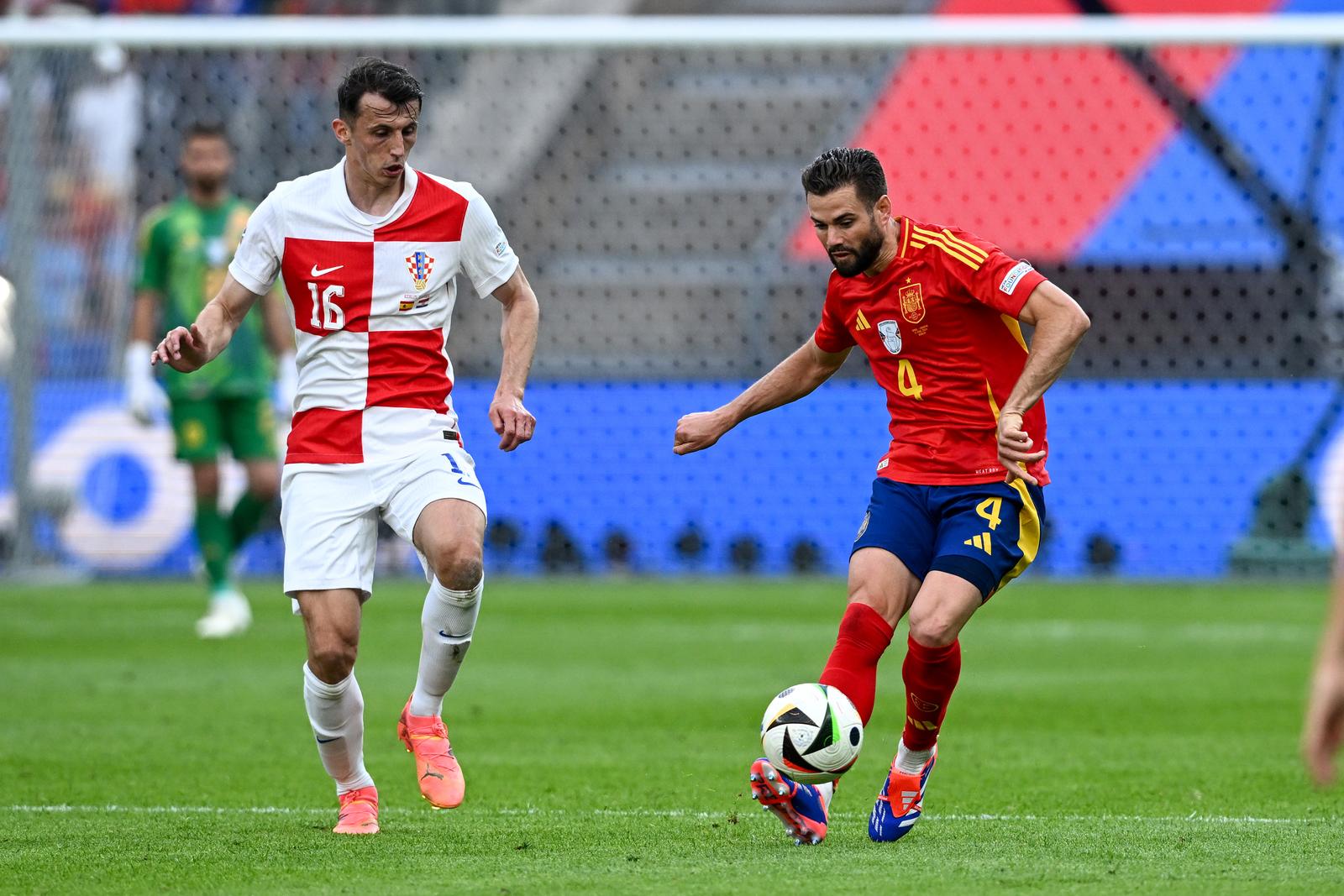 15.06.2024., Olimpijski stadion, Berlin, Njemacka - Europsko prvenstvo 2024., skupina B, 1. kolo, Spanjolska - Hrvatska.Ante Budimir, Nacho. Photo: Marko Lukunic/PIXSELL