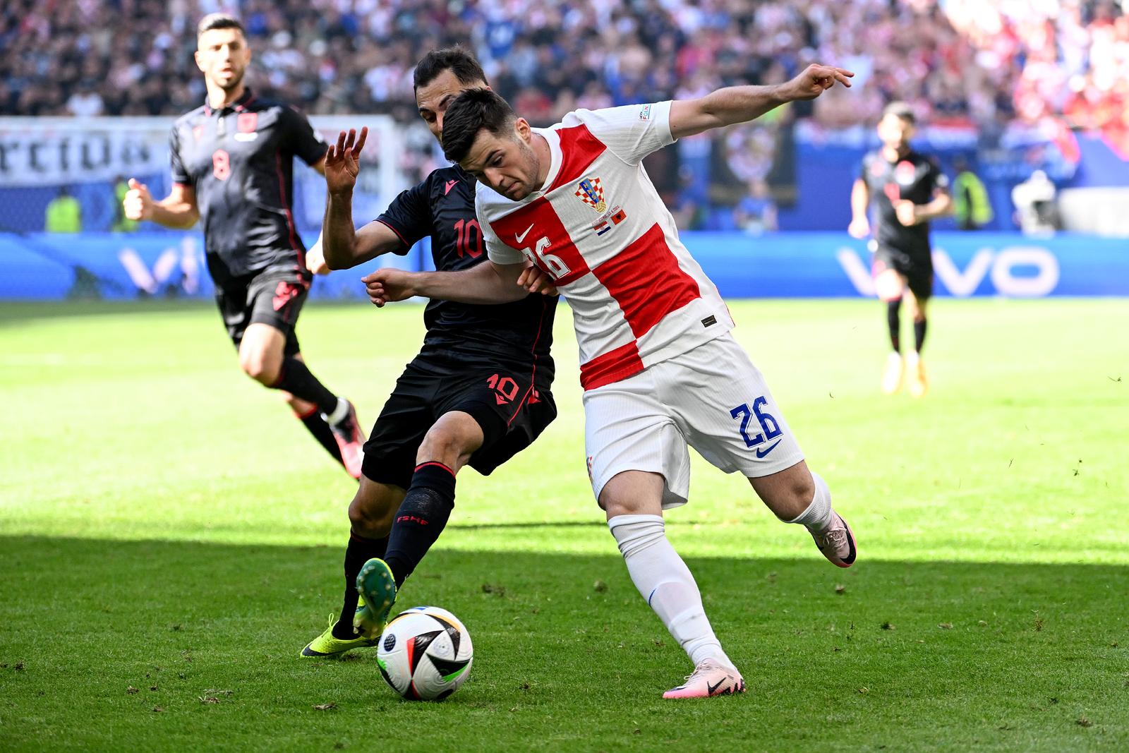 19.06.2024., Volksparkstadion, Hamburg, Njemacka - Europsko prvenstvo 2024., skupina B, 2. kolo, Hrvatska - Albanija. Martin Baturina, Nedim Bajrami. Photo: Marko Lukunic/PIXSELL