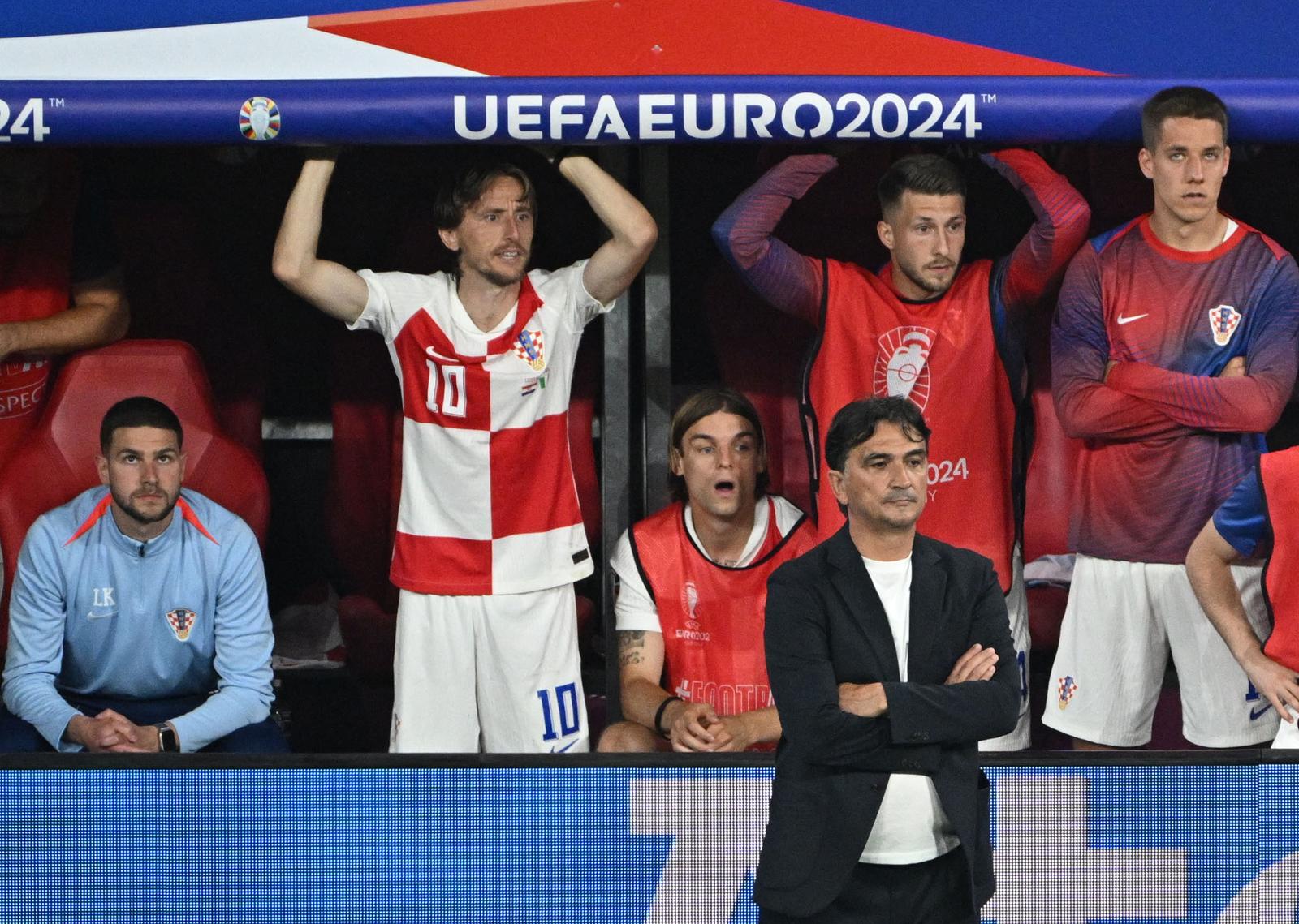 Soccer Football - Euro 2024 - Group B - Croatia v Italy - Leipzig Stadium, Leipzig, Germany - June 24, 2024  Croatia's Luka Modric with teammates and coach Zlatko Dalic react REUTERS/Annegret Hilse Photo: Annegret Hilse/REUTERS