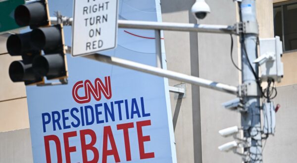 CNN signage near a traffic light with security cameras is displayed outside the studios at the Turner Entertainment Networks as Atlanta prepares one day ahead of the first 2024 presidential debate between US President Joe Biden and former President Donald Trump, on June 26, 2024.,Image: 884963881, License: Rights-managed, Restrictions: , Model Release: no, Credit line: ANDREW CABALLERO-REYNOLDS / AFP / Profimedia
