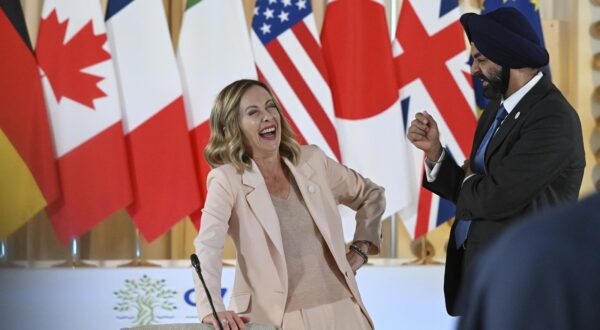 epa11408359 Giorgia Meloni (L), Prime Minister of Italy, speaks with Ajay Banga, President of the World Bank, attend at the table dedicated to the partnership for global infrastructure and investment during the G7 summit in Borgo Egnazia, Brindisi, Italy, 13 June 2024. The 50th G7 summit will bring together the Group of Seven member states leaders in Borgo Egnazia resort in southern Italy from 13 to 15 June 2024.  EPA/CIRO FUSCO