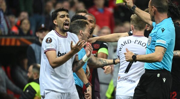 West Ham United's Brazilian midfielder #10 Lucas Paqueta reacts after receiving a yellow card for a tackle on Bayer Leverkusen's French forward #21 Amine Adli (not pictured) during the UEFA Europa League quarter-final first leg football match between Bayer 04 Leverkusen and West Ham United FC in Leverkusen, western Germany on April 11, 2024.,Image: 864124293, License: Rights-managed, Restrictions: , Model Release: no, Credit line: INA FASSBENDER / AFP / Profimedia