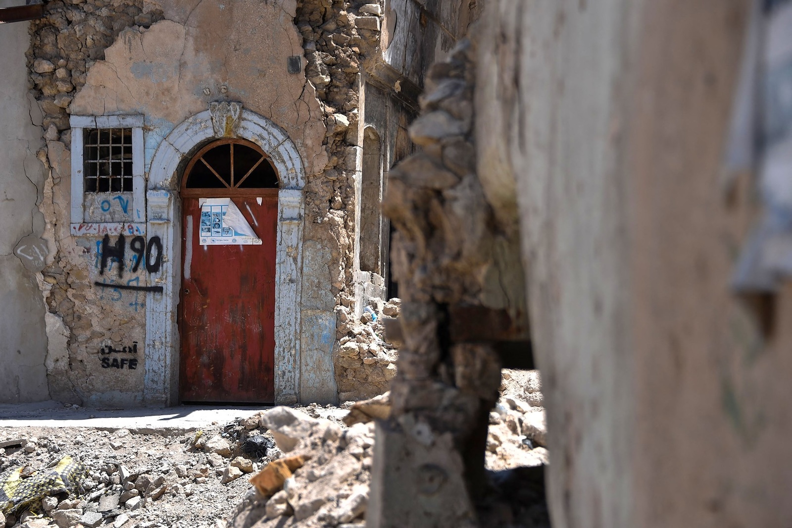 A general view shows a  building destroyed during battles to defeat the Islamic State group, in the old city of Mosul in northern Iraq on June 1, 2024. Ten years ago, the Islamic State group rampaged across Iraq's ancient city of Mosul declaring a "caliphate" that ruled with beheadings, torture and enslavement, turning life into living hell.  
After gruelling battles, US-backed Iraqi forces drove IS out of Mosul in 2017 and announced the groups' defeat in Iraq, leaving the city's traumatised residents to rebuild their shattered lives.,Image: 879231597, License: Rights-managed, Restrictions: TO GO WITH 'IRAQ-CONFLICT-IS-SURVIVORS-TESTIMONIES' FOCUS BY MOHAMMED SALIM, Model Release: no, Credit line: Zaid AL-OBEIDI / AFP / Profimedia